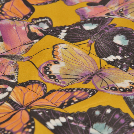 Курточная стеганная двухсторонняя ткань в желтых тонах с бабочками