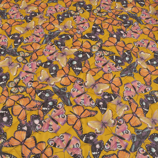 Курточная стеганная двухсторонняя ткань в желтых тонах с бабочками