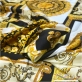 Шелк атласный стрейч дизайн Versace пэчворк в золотисто-черной гамме