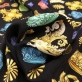 Шелк матовый стрейч принт D&G цветные короны на черном фоне